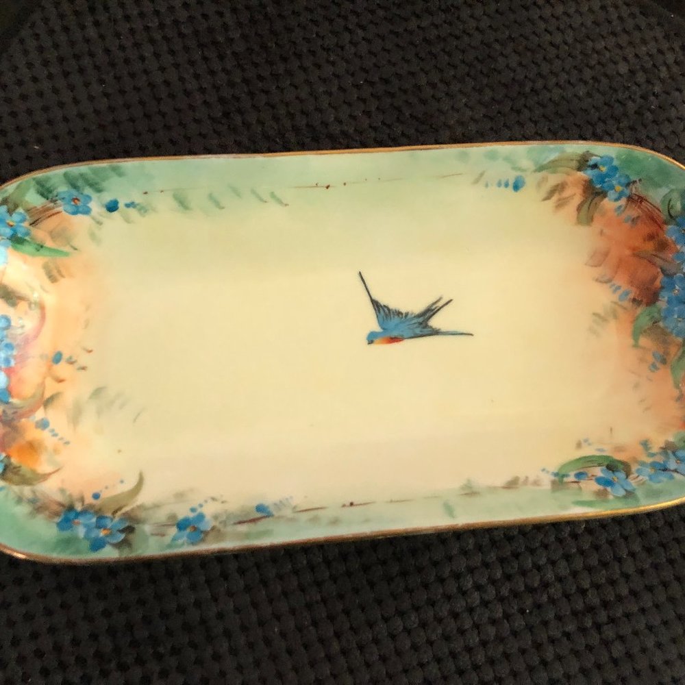 Very old and beautiful hand painted dish with bluebird in the middle